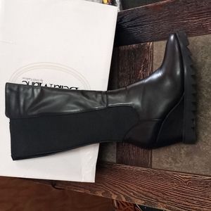 black platform boot with elastic material on the back